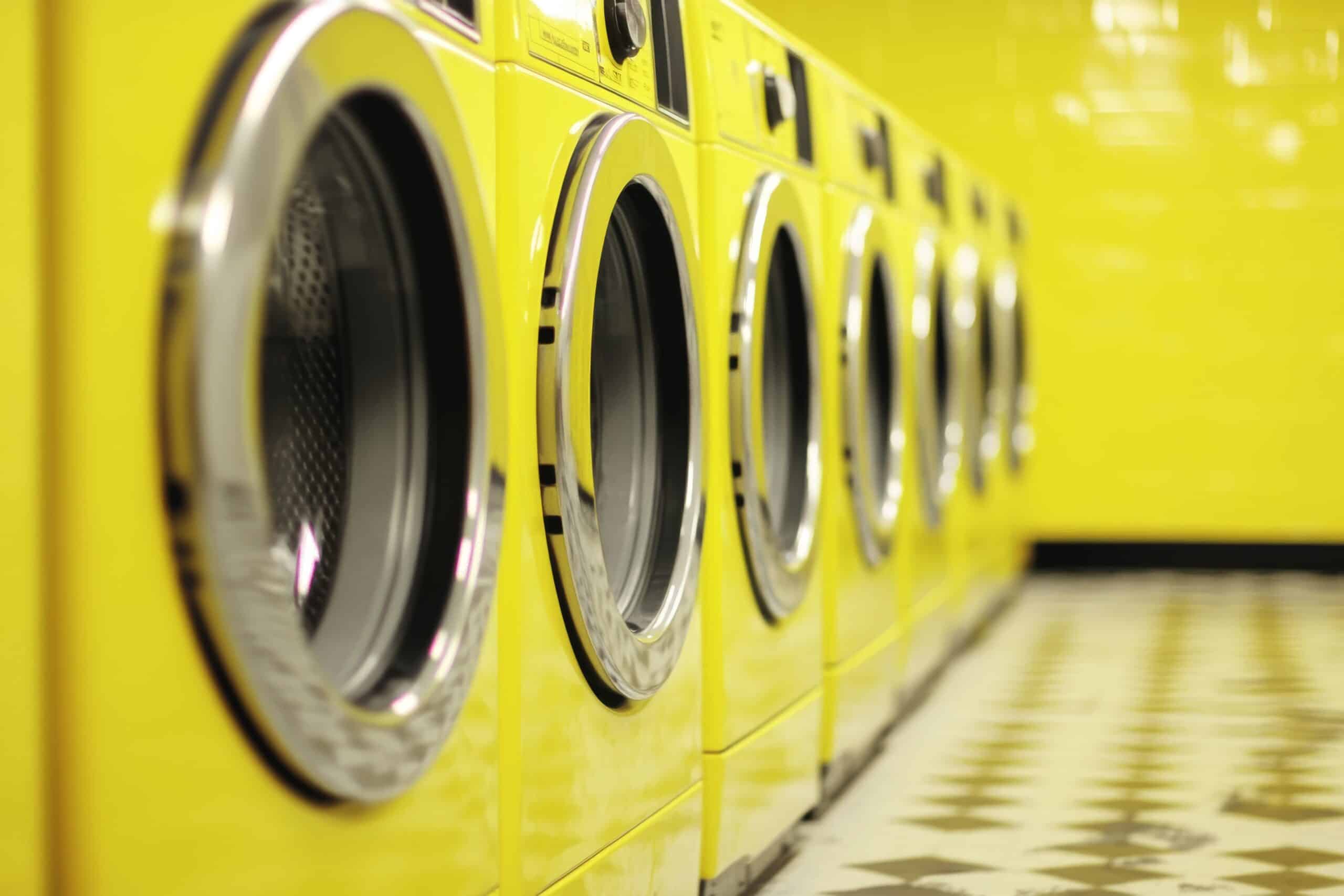 Row of professional laundry machines for care home equipment installation